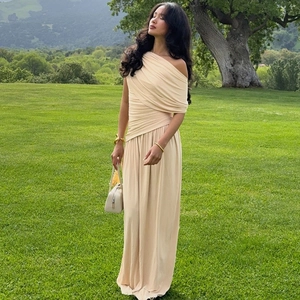 Elegant one-shoulder beige maxi dress featuring sophisticated pleated texture and slim fit