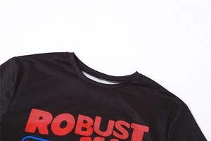 Close-up of the round neckline on a black T-shirt with bold red ROBUST print detailing