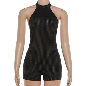 Detail of sexy black halter romper with shimmering silver glitter dots and slim fit
