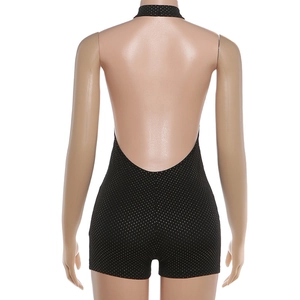 Detail of sexy backless halter neck romper featuring shimmering black sequins for parties