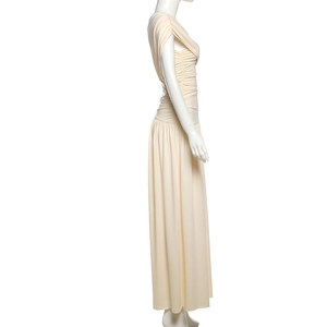 Detail of elegant cream off-shoulder maxi dress featuring ruched bodice and flowing skirt