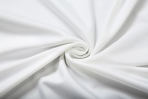 Close-up of white high-density fabric texture with detailed diagonal twill weave