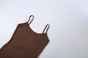 Detailed view of dark brown camisole with thin straps and elastic knit texture