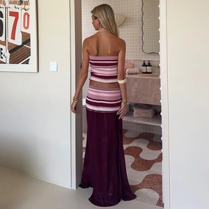 Detail of striped knit tube top and sheer patchwork long skirt in pink and burgundy