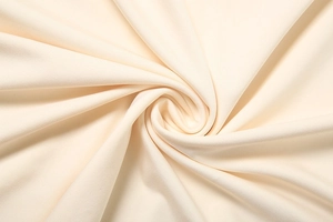 Detail shot of cream white fabric showing twill texture and soft drape of the maxi dress
