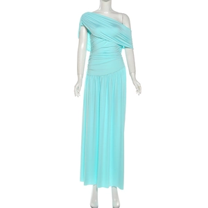Detailed view of the pleated waist and flowing hem on a light blue one-shoulder maxi dress