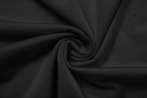 Vue macro détaillée du tissu en sergé noir de haute qualité avec texture douce et drapé