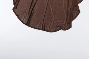 Detailed close-up of dark brown mesh fabric showing fine stitching and sheer texture