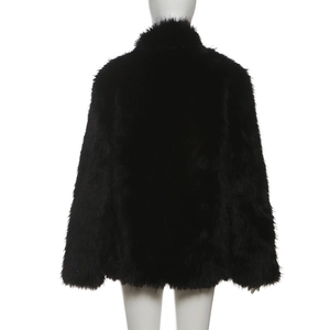 Back view detail of women's black faux fur jacket with soft fluffy texture and loose fit