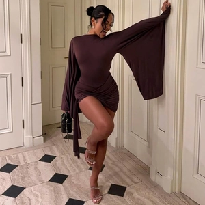 Detail of a dark brown knit bodycon dress with oversized wide sleeves and side ruching