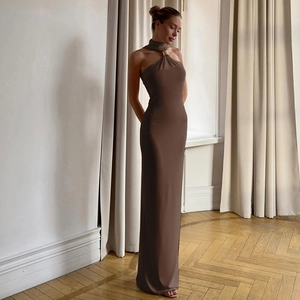 Detail of the chocolate halter neck dress showing the golden metal ring fastener