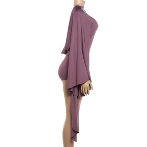 Side view of dark purple bodycon romper featuring dramatic extra long flared sleeves