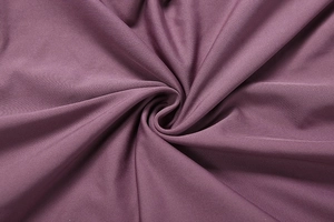 Close-up of high-elasticity dark purple knitted fabric texture showing premium softness