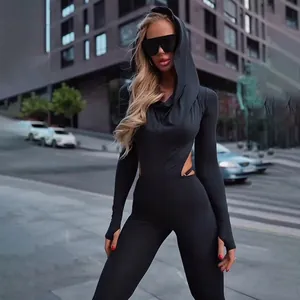 Close-up of black bodycon jumpsuit with hooded neckline and stylish thumbhole cuffs