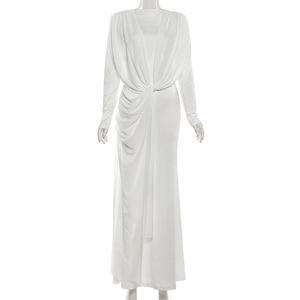 Detail of twisted knot waist design on elegant white long-sleeved mesh maxi dress