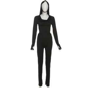 Detail view of black hooded jumpsuit with backless design and thumbhole long sleeves