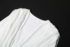 Detail of white slim-fit mesh dress featuring a round neck and pleated shoulder design