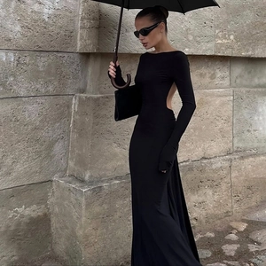 Elegant black backless long sleeve maxi dress with chain detail and floor-length skirt
