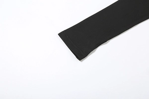 Detail of double-needle stitching and fabric texture on a black long-sleeve cuff
