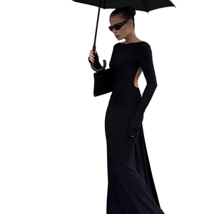 Elegant slim fit backless black maxi dress with long sleeves and floor-length hemline