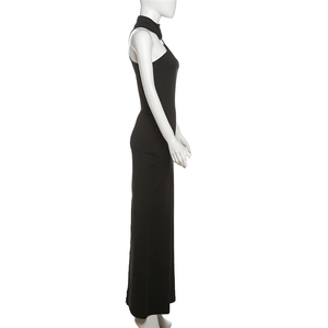 Side view of sleek black halter neck maxi dress showing slim fit and ankle length