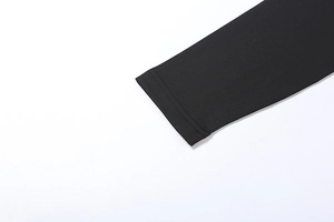 Detailed close-up showing double-needle stitching on black mesh long dress sleeve cuff