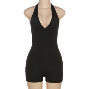 Detail shot of black halter-neck romper featuring a deep V-neck and bodycon fit on mannequin