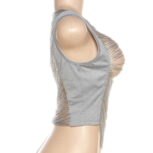 Detail of grey sleeveless knit top featuring hollow-out cutouts and fine fringe tassels