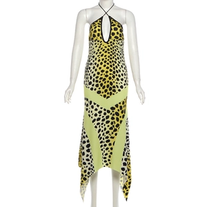 Detail of leopard print halter maxi dress with green V-panel and asymmetric hemline