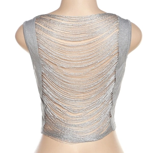 Macro detail of silver fringe cut-out design on the back of a sleeveless crop top
