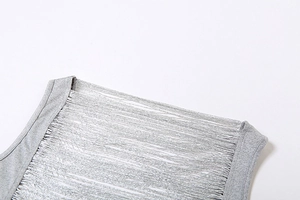 Detail view of the gray sleeveless top featuring hollowed-out shredded fringe texture