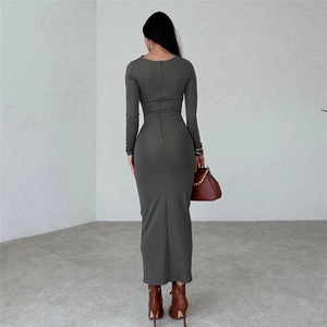 Rear view of long sleeve slim fit dress with concealed back zipper and ruched detail