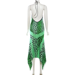 Detail of green leopard print maxi dress showing halter neck ties and backless design