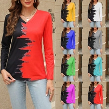 Detail of V-neck long sleeve tee with colorful contrast stitching and patchwork design