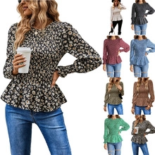 Detail of floral ruffle blouse showing elastic waist and multiple color options