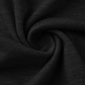 Macro shot of black knitted cotton fabric texture with soft drape and weave detail