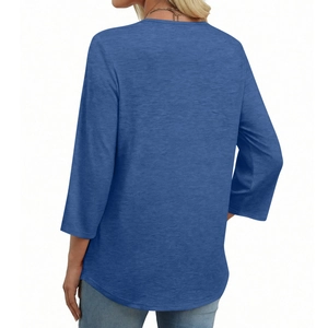 Rear view of blue V-neck top with lace trim and textured knit fabric three-quarter sleeves