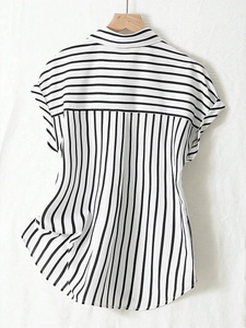 Rear view of striped short sleeve shirt showing horizontal yoke and vertical patterns