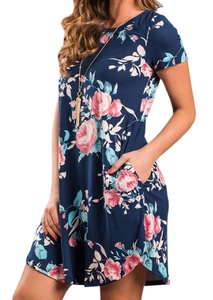 Detail of short-sleeve navy dress with pink rose print and functional side pockets