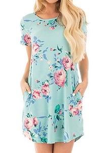Detail of mint green summer dress with pink rose floral print and side pockets
