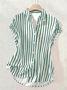 Detailed view of green and white vertical striped short sleeve shirt with button-down collar