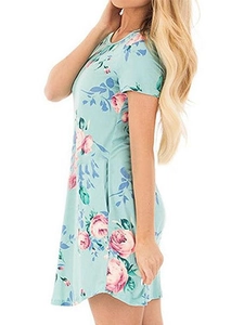 Detail of floral print on mint green dress with pink roses and blue leaf patterns