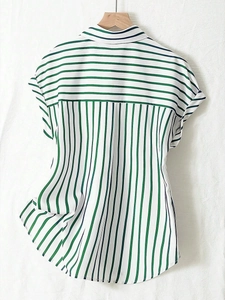 Back view of women's green striped short sleeve shirt showing the contrast yoke detail
