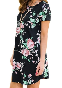 Detail of short sleeve summer dress featuring realistic pink rose prints on black fabric
