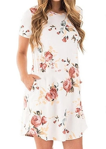 Detail of floral printed white summer dress with short sleeves and side pockets