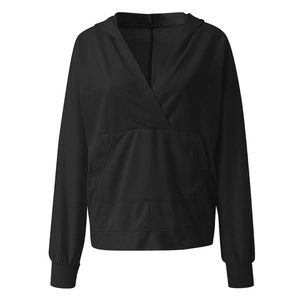 Detail view of black hoodie featuring a unique deep V-neck cross collar and kangaroo pocket