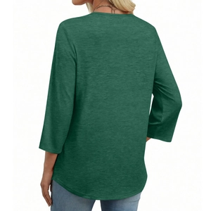 Rear view of dark green v-neck top showing textured fabric and high-quality stitching