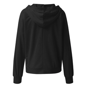 Detailed back view of a solid black hoodie with a central seam and ribbed hemline