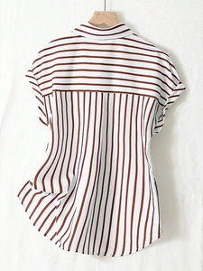 Detailed view of women's short sleeve striped shirt with spliced pattern and collar