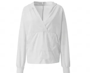 Detail view of white hoodie featuring a unique deep V-neck and front kangaroo pocket